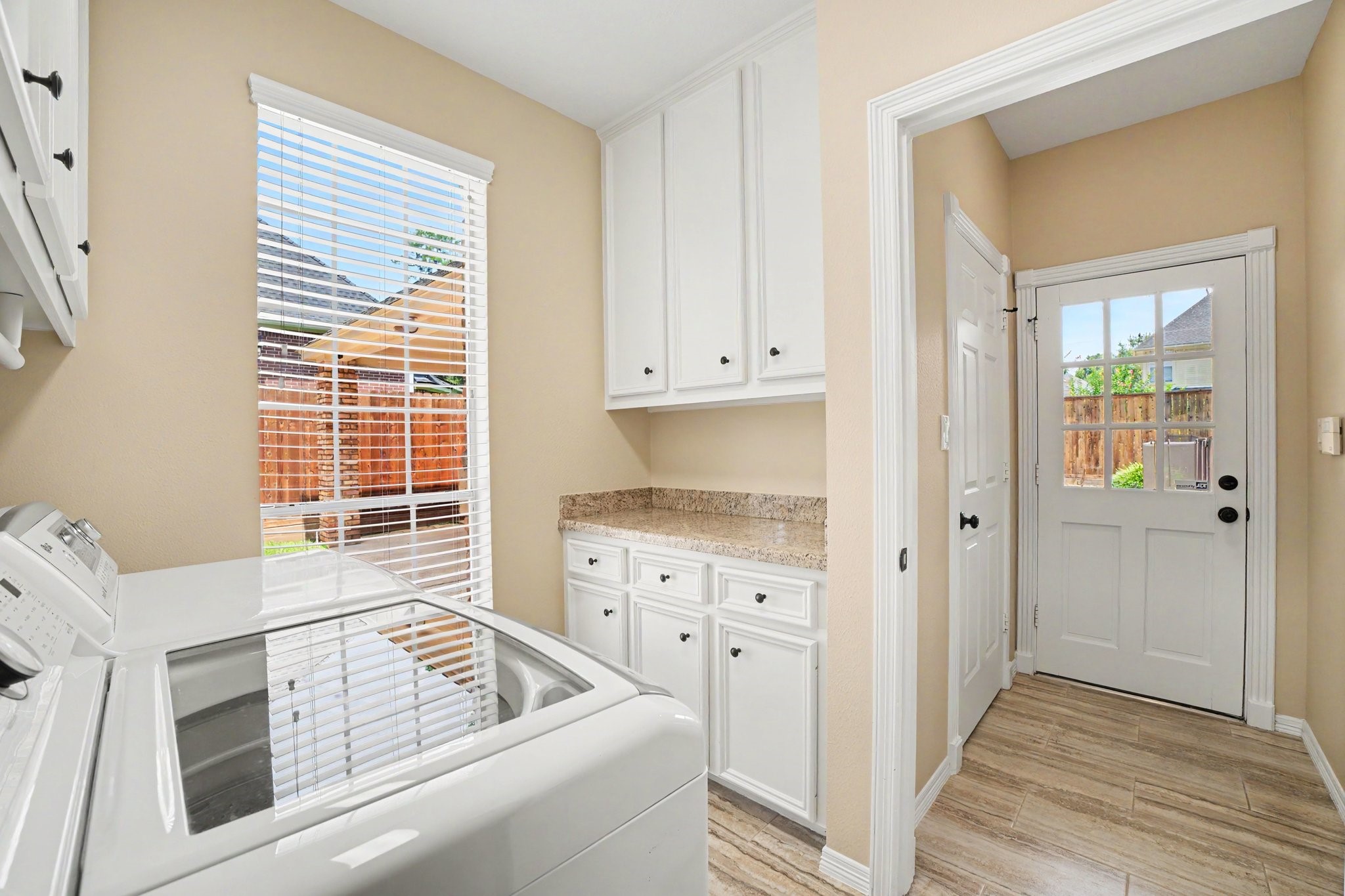 3411 Fir Forest Drive Spring, TX 77388 - Photo 23 of 39 Another view of the utility room with more cabinets and a countertop for easy laundry folding.