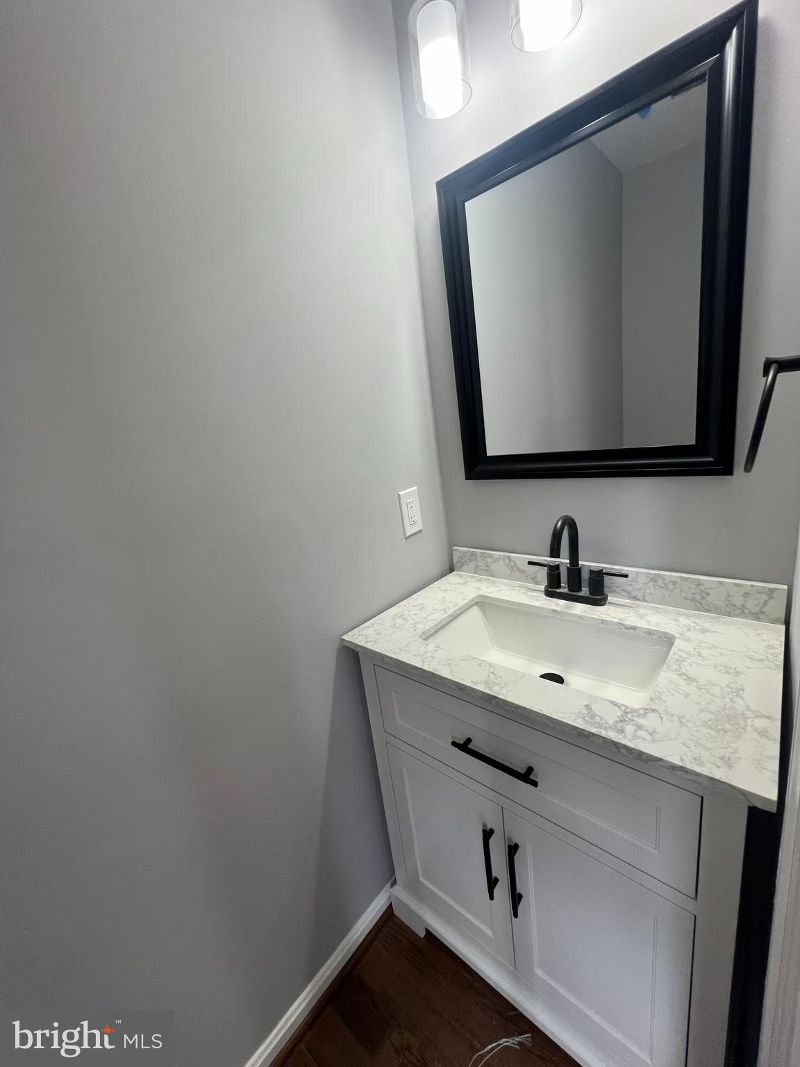 9864 Greenbriar Way Middle River, MD 21220 - Photo 13 of 17 a bathroom with a granite countertop sink and a mirror