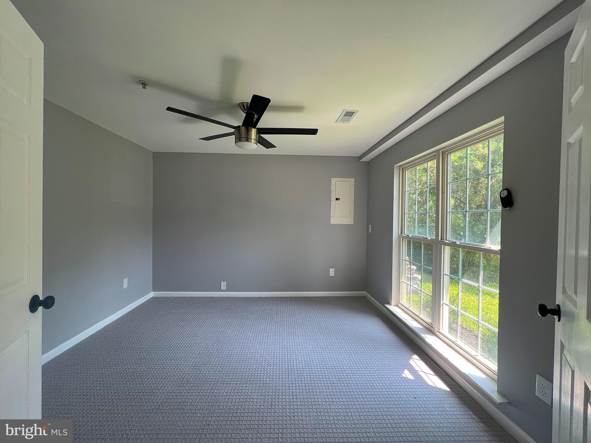 9864 Greenbriar Way Middle River, MD 21220 - Photo 4 of 17 a view of a livingroom with a ceiling fan and window