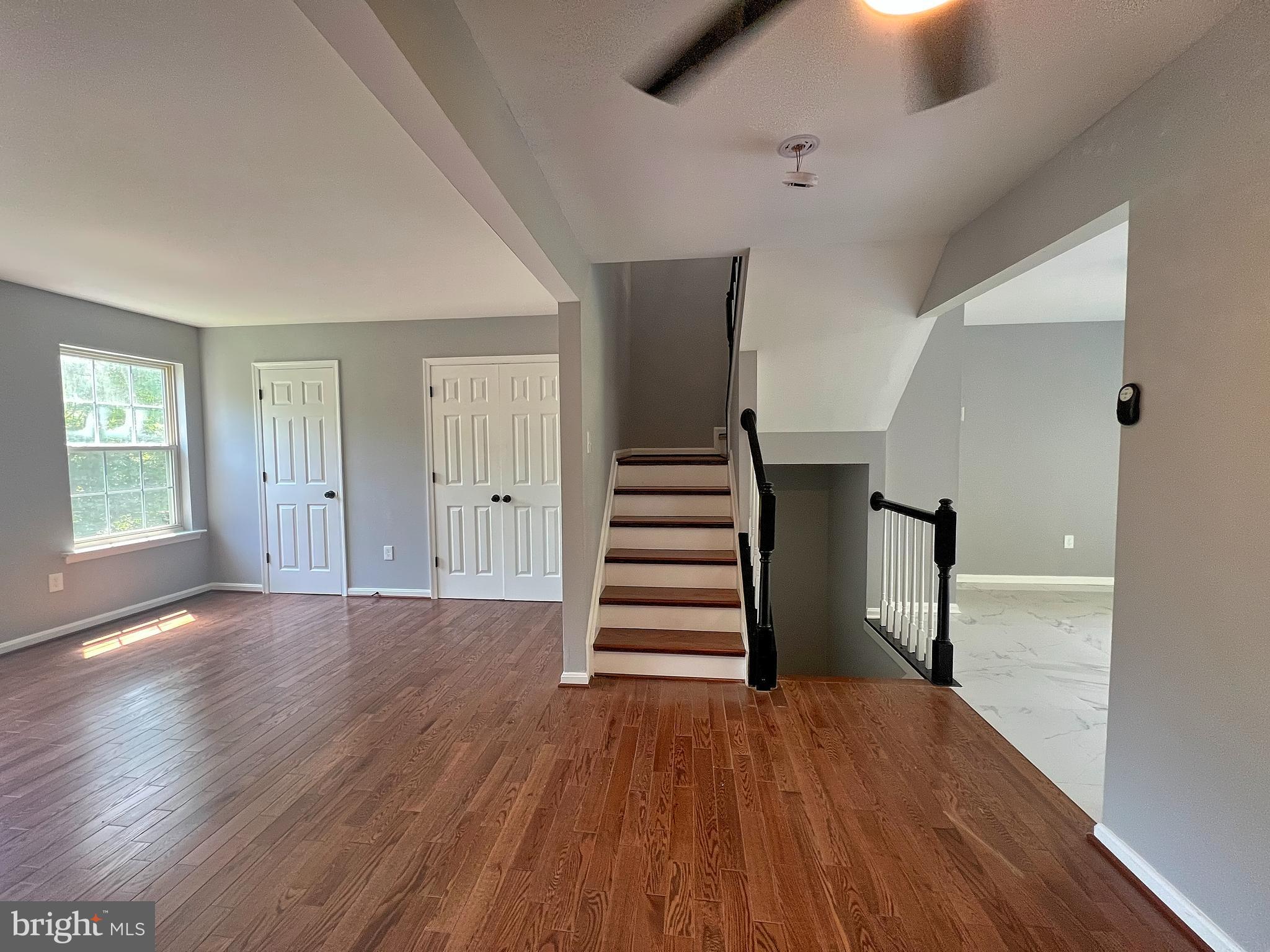 9864 Greenbriar Way Middle River, MD 21220 - Photo 7 of 17 wooden floor in an empty room with a window