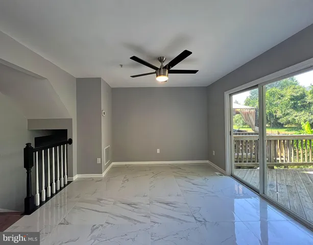 a view of an empty room with a balcony