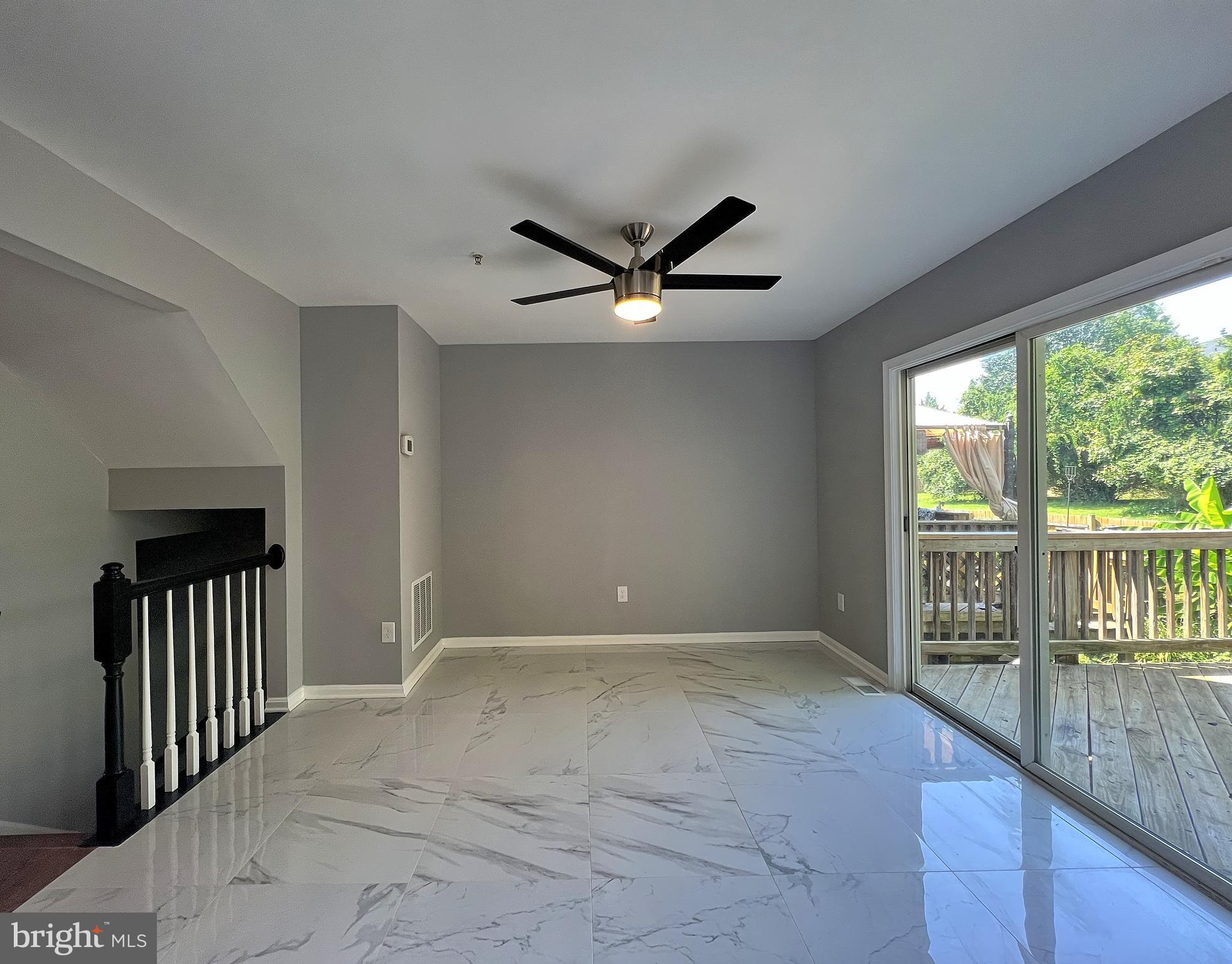 9864 Greenbriar Way Middle River, MD 21220 - Photo 8 of 17 a view of an empty room with a balcony