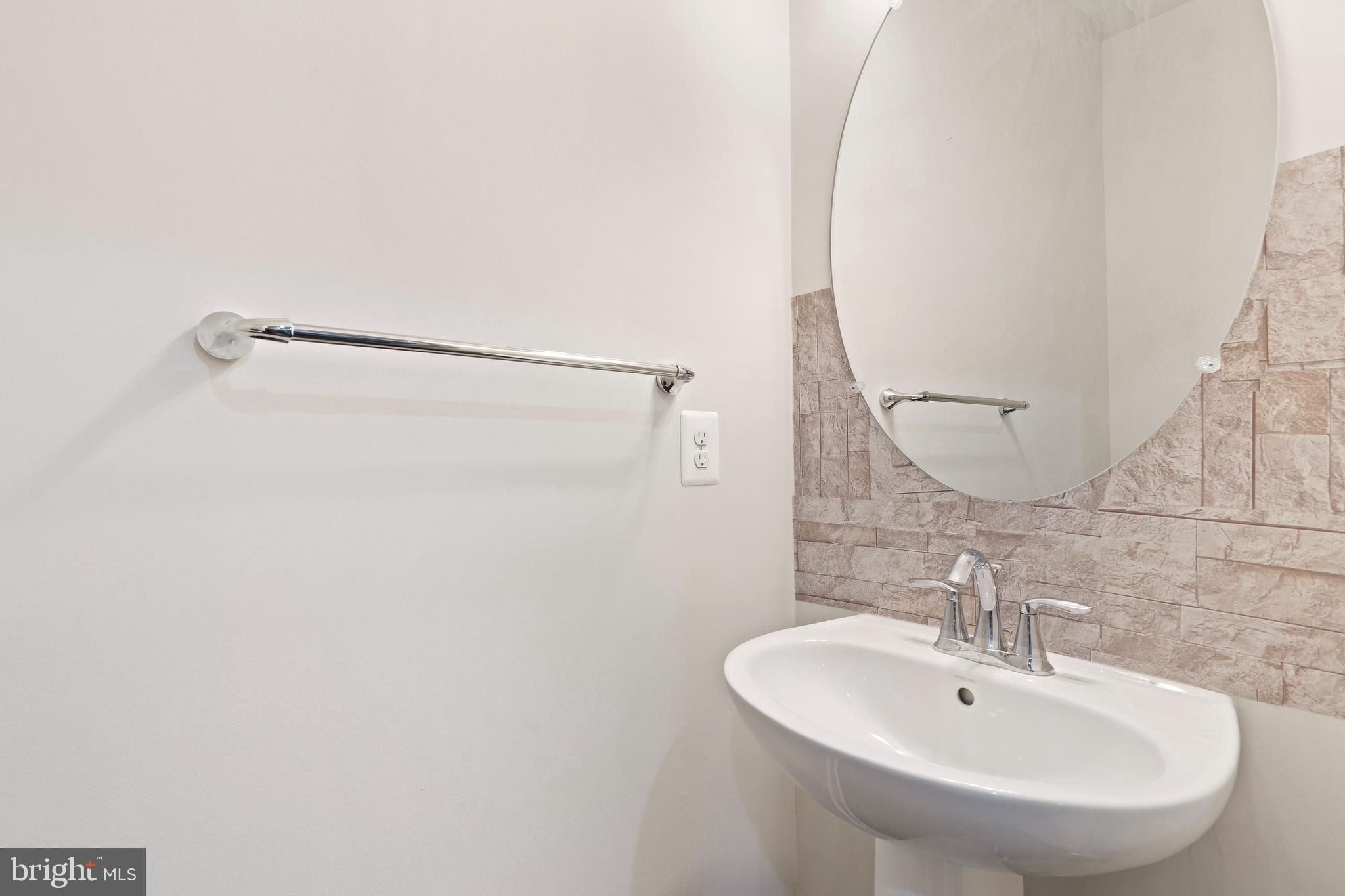 3516 Flatwoods Drive Frederick, MD 21704 - Photo 16 of 41 a bathroom with a sink a mirror and a shower