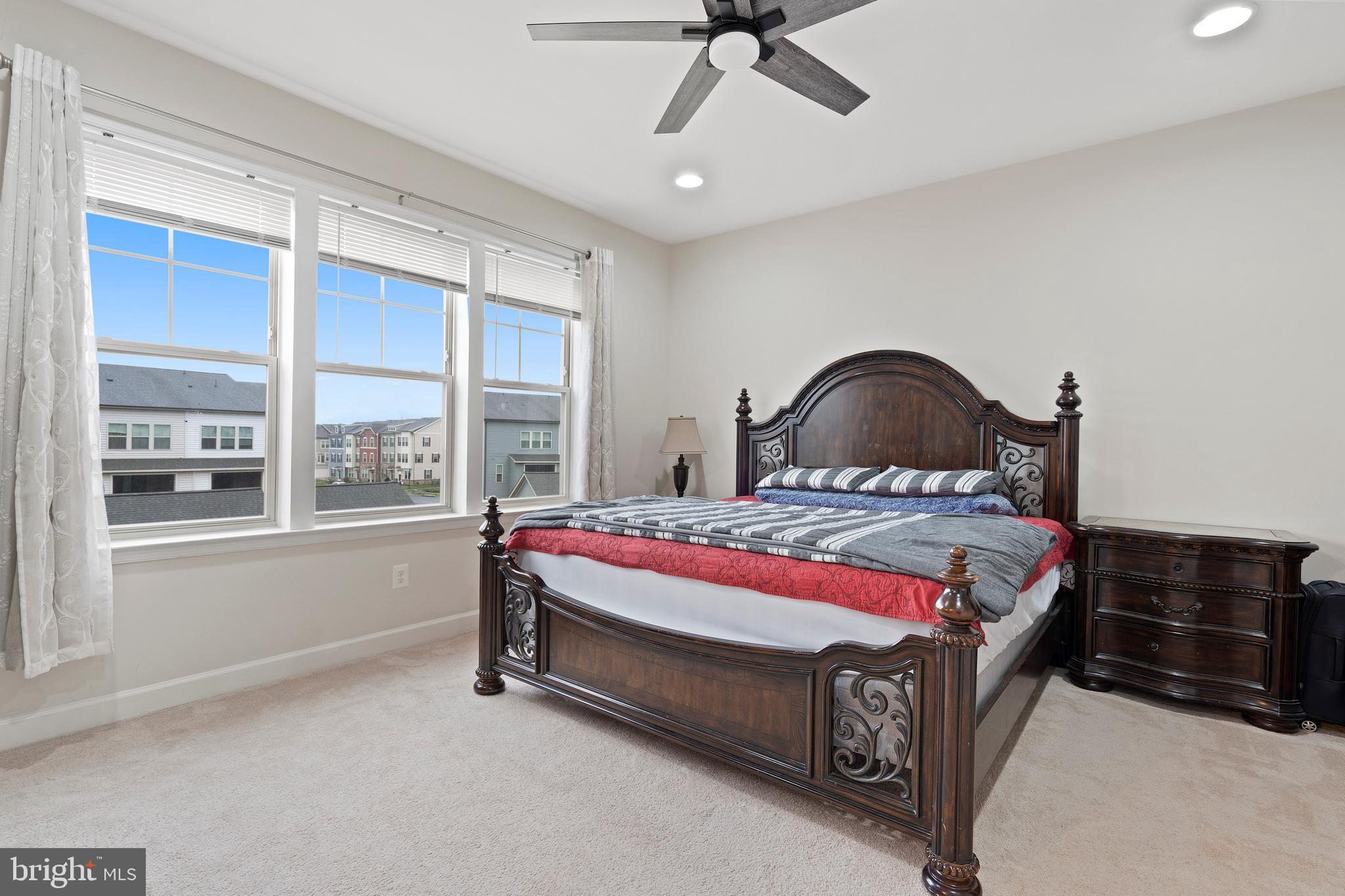 3516 Flatwoods Drive Frederick, MD 21704 - Photo 17 of 41 a bed sitting in a bedroom next to a window