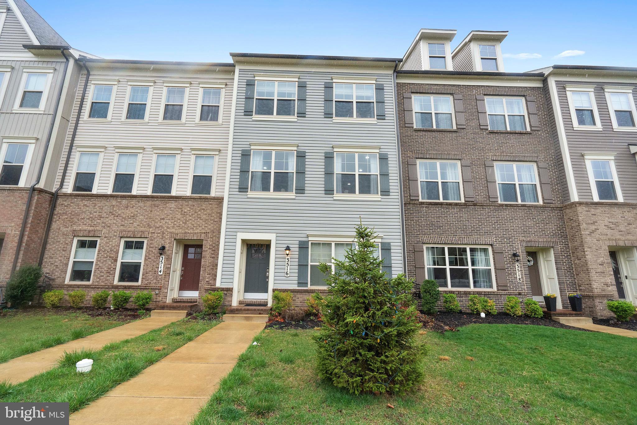 3516 Flatwoods Drive Frederick, MD 21704 - Photo 2 of 41 a front view of a building with garden