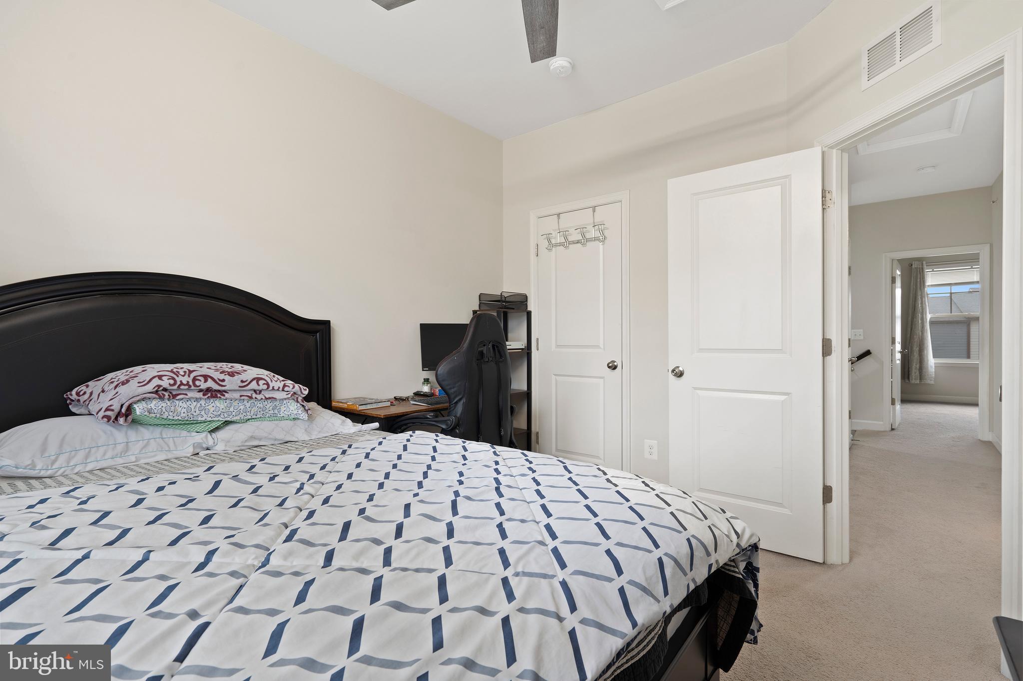 3516 Flatwoods Drive Frederick, MD 21704 - Photo 23 of 41 a bedroom with a bed and wooden floor