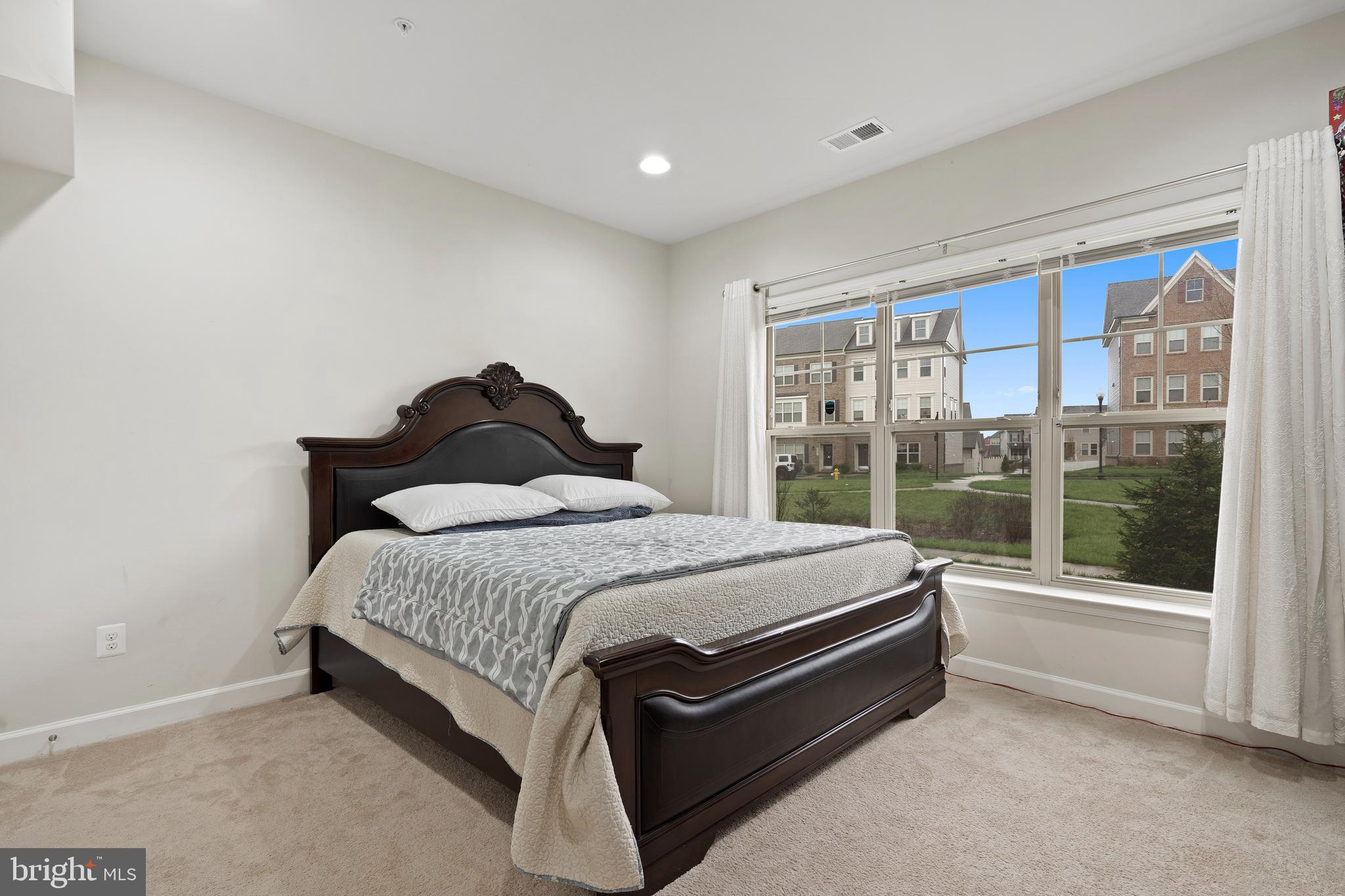 3516 Flatwoods Drive Frederick, MD 21704 - Photo 31 of 41 a bed sitting in a spacious bedroom next to a window