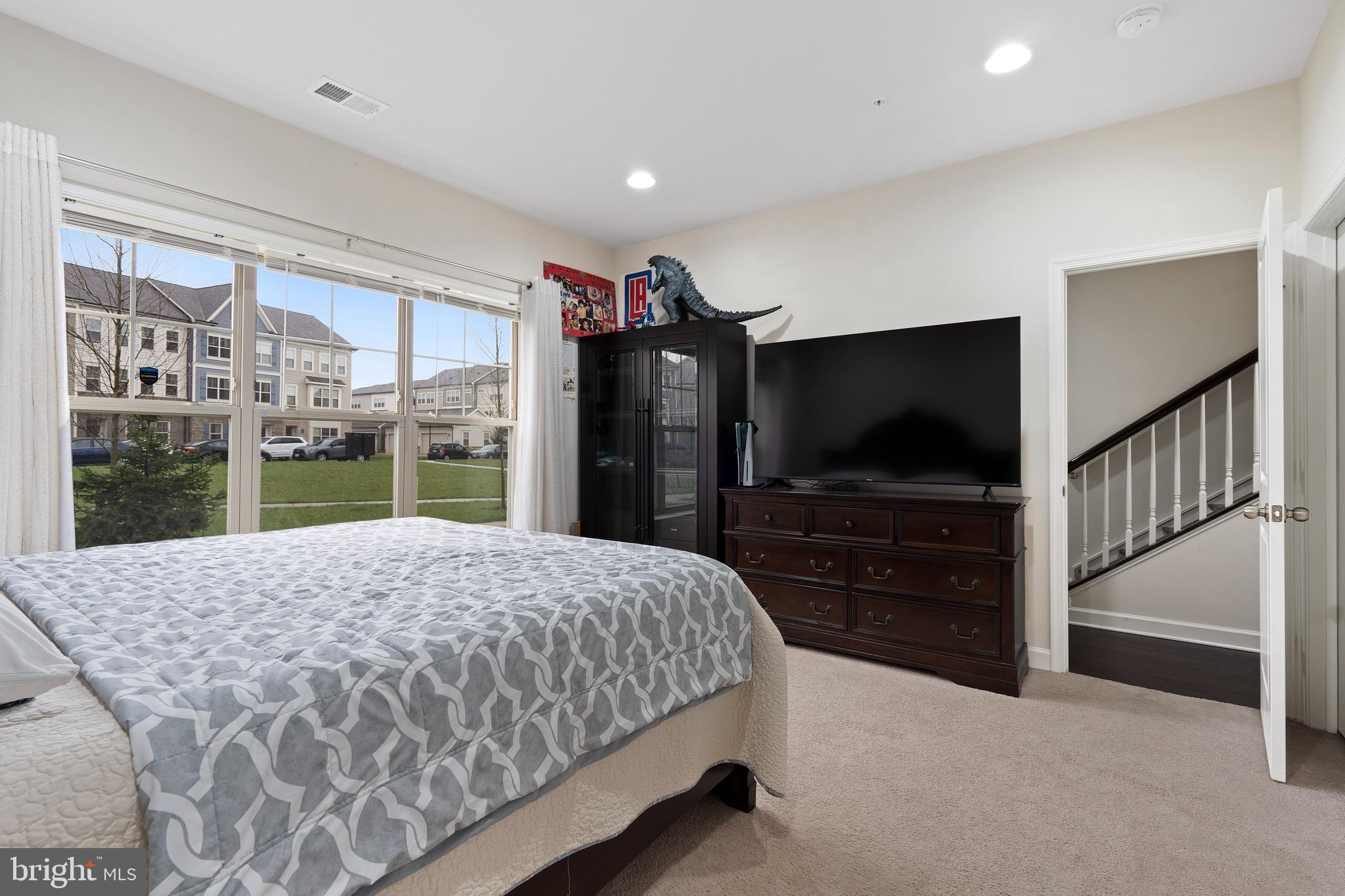 3516 Flatwoods Drive Frederick, MD 21704 - Photo 32 of 41 a bedroom with a bed and a flat screen tv