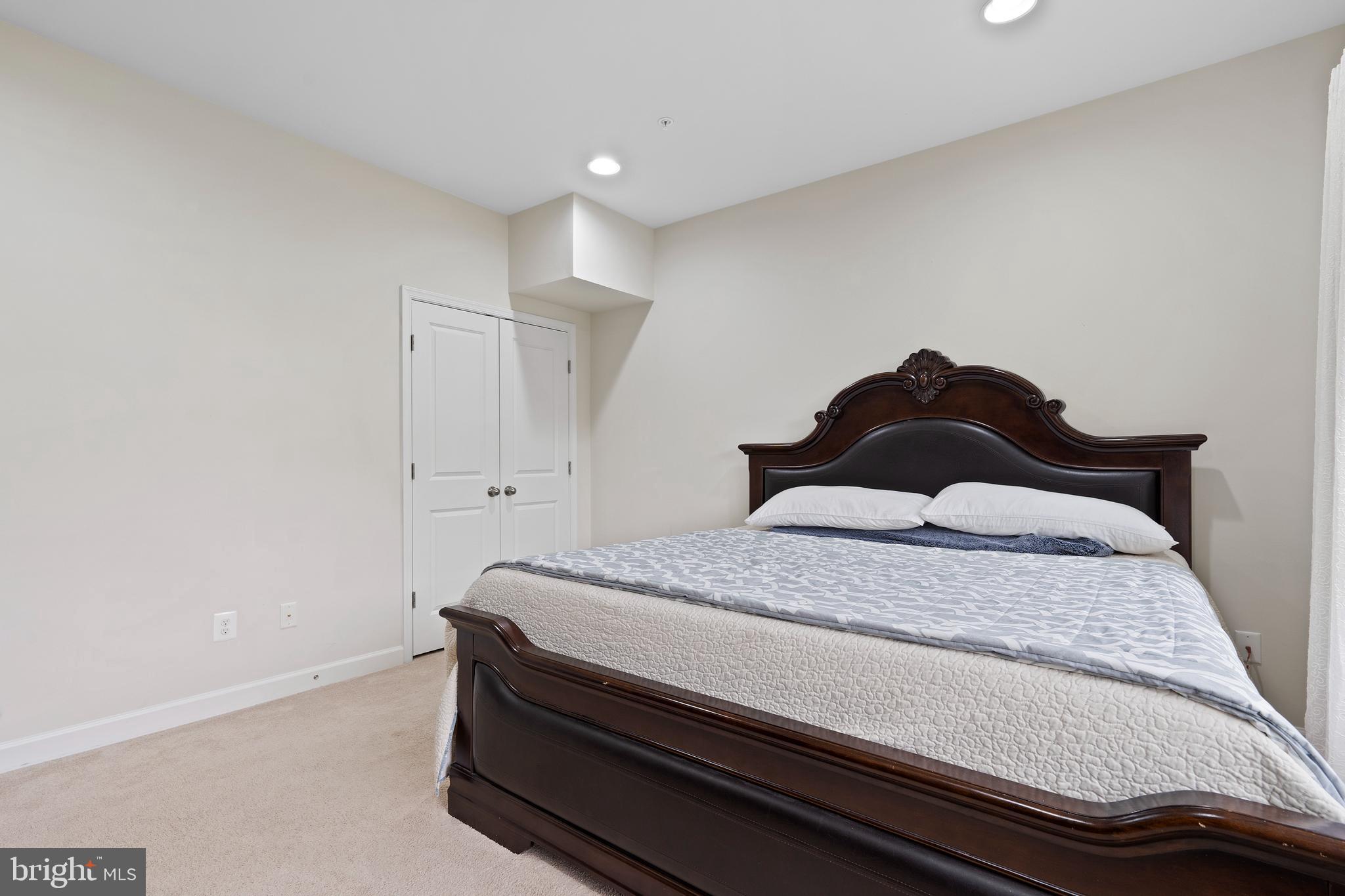 3516 Flatwoods Drive Frederick, MD 21704 - Photo 33 of 41 a bedroom with a bed and a wall painting