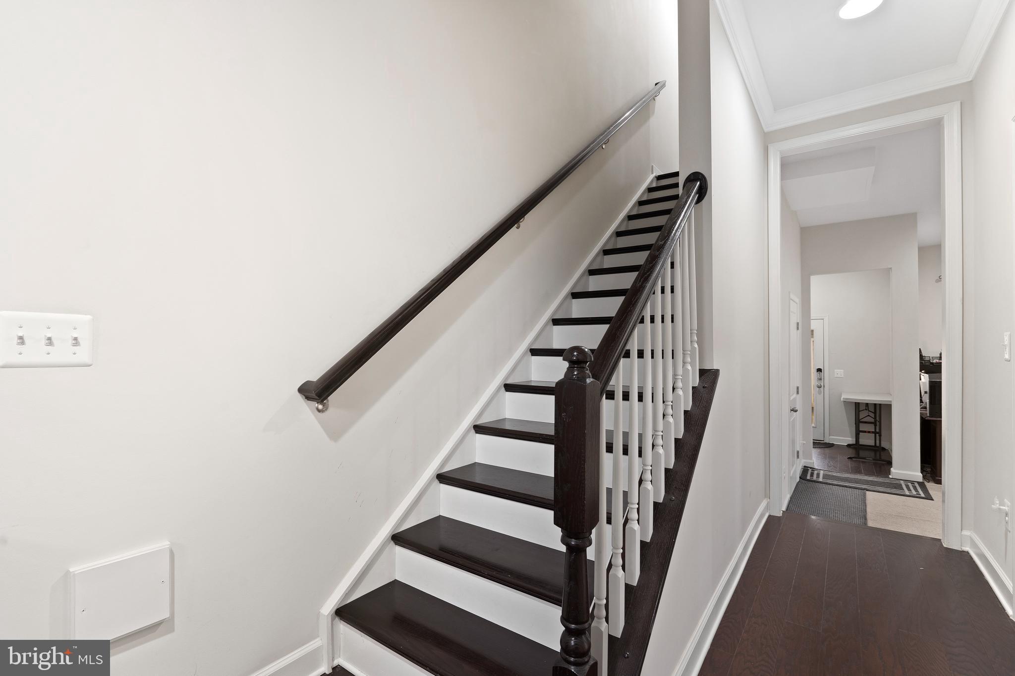 3516 Flatwoods Drive Frederick, MD 21704 - Photo 4 of 41 a view of staircase with wooden floor and white walls