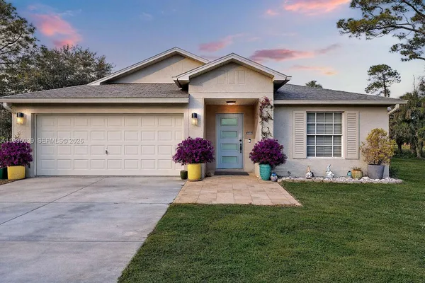 a front view of a house with yard