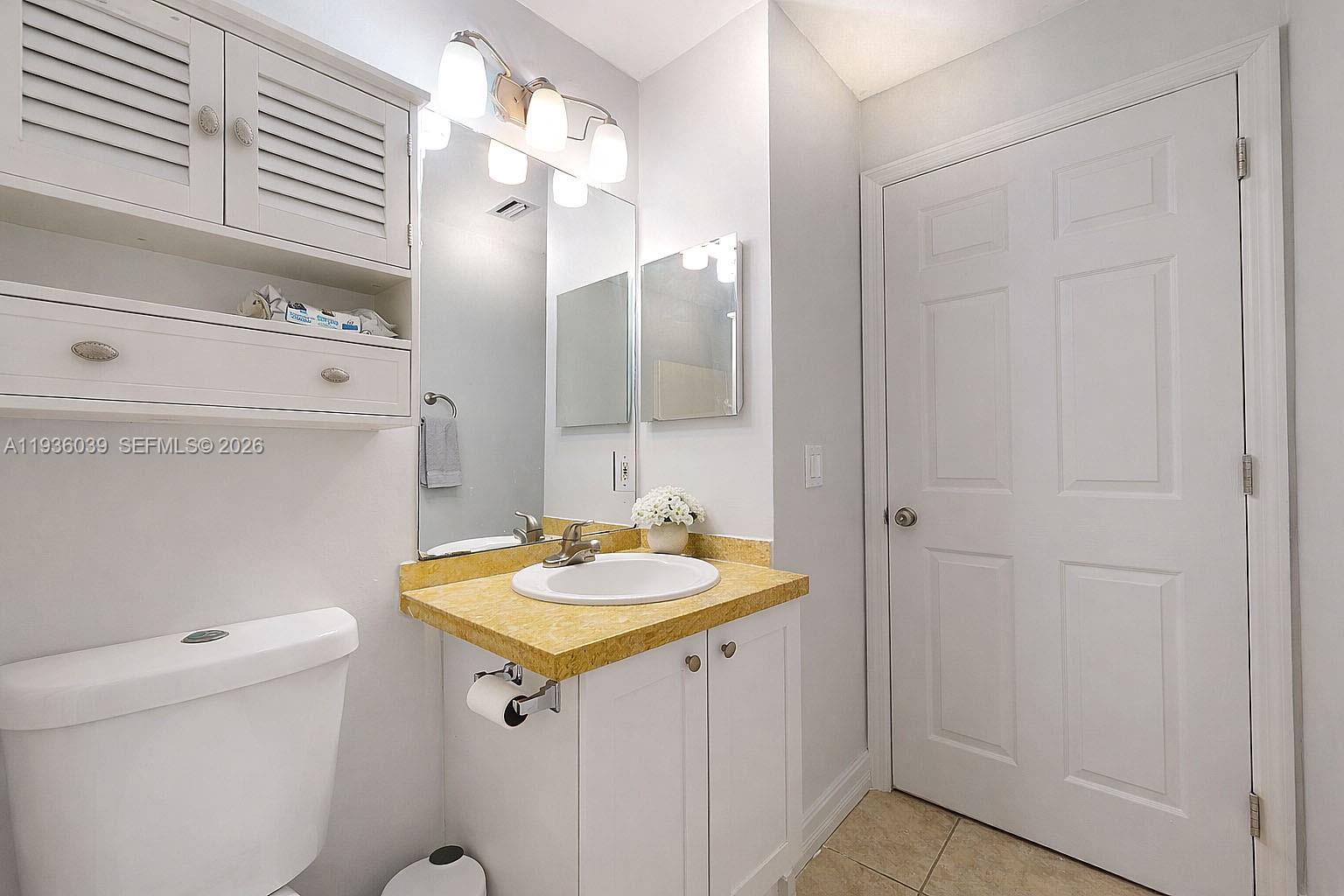 2625 40th Avenue Southeast Naples, FL 34117 - Photo 26 of 81 a bathroom with a sink a toilet and shower