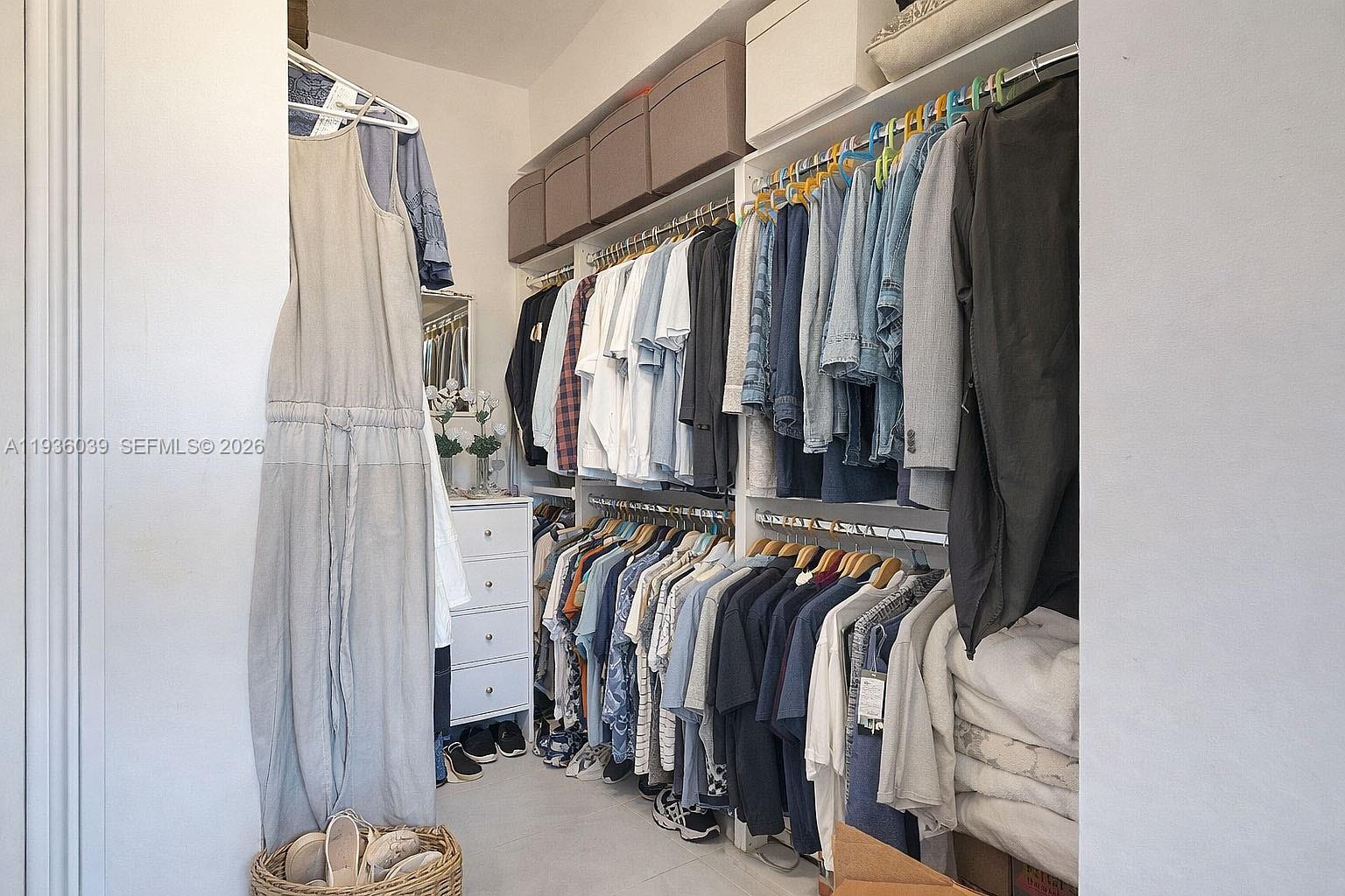 2625 40th Avenue Southeast Naples, FL 34117 - Photo 29 of 81 a view of walk in closet with clothes and shoes