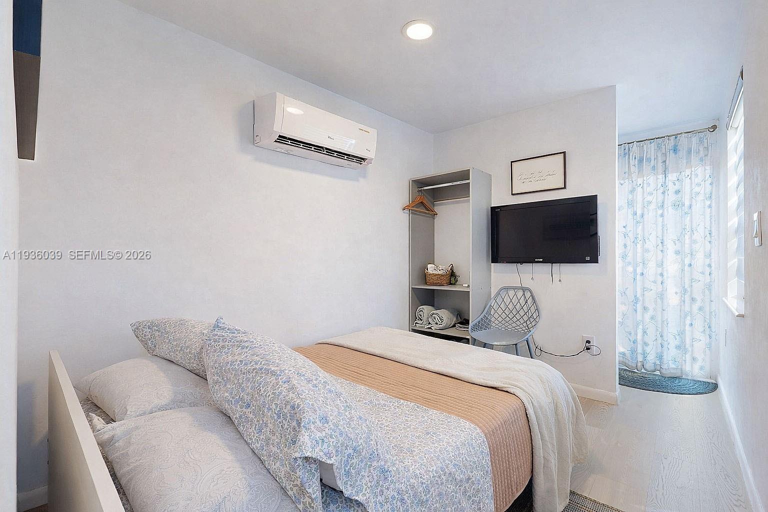 2625 40th Avenue Southeast Naples, FL 34117 - Photo 30 of 81 a bedroom with a bed and a flat screen tv