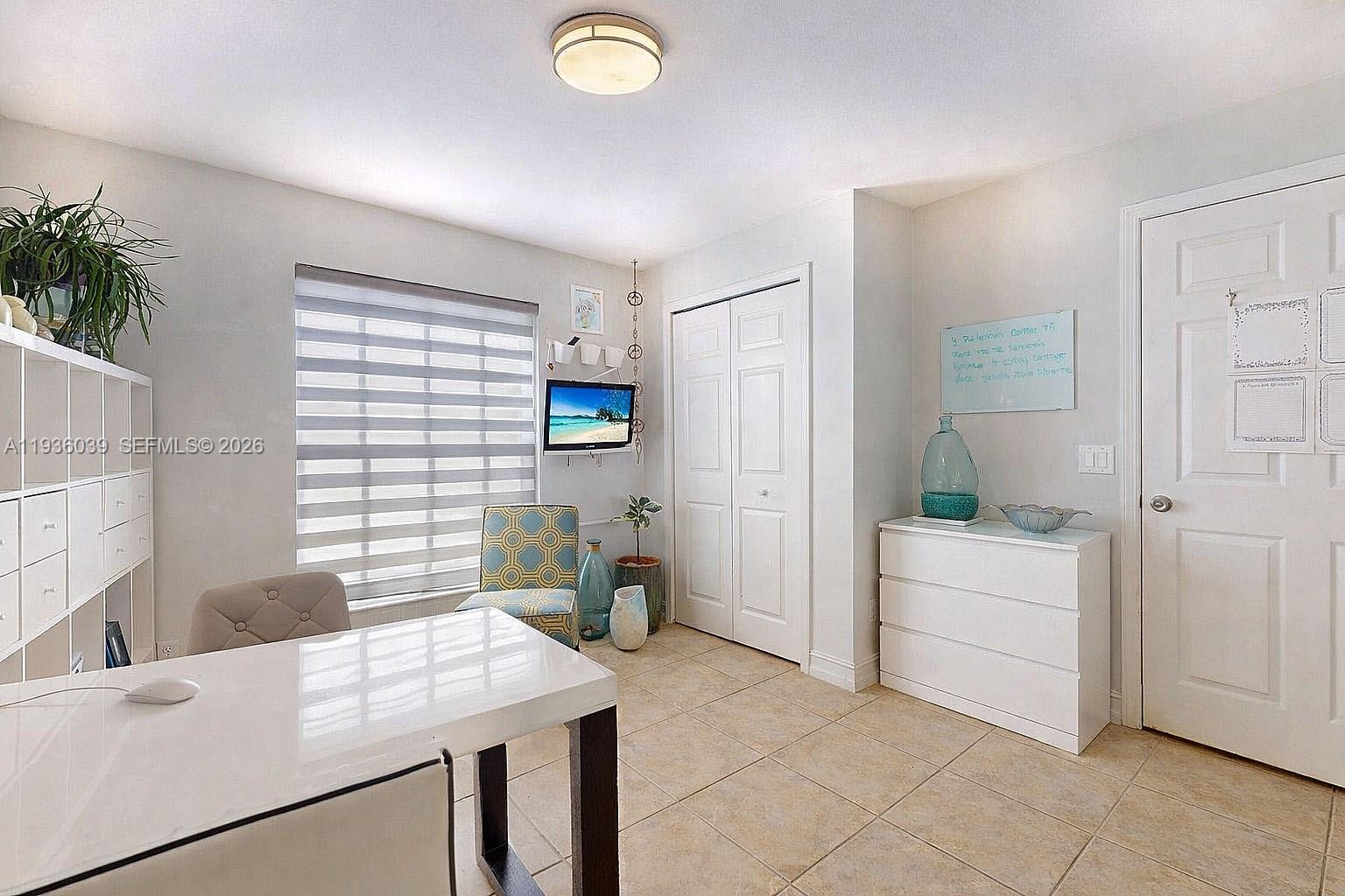 2625 40th Avenue Southeast Naples, FL 34117 - Photo 37 of 81 a living room with furniture and a window