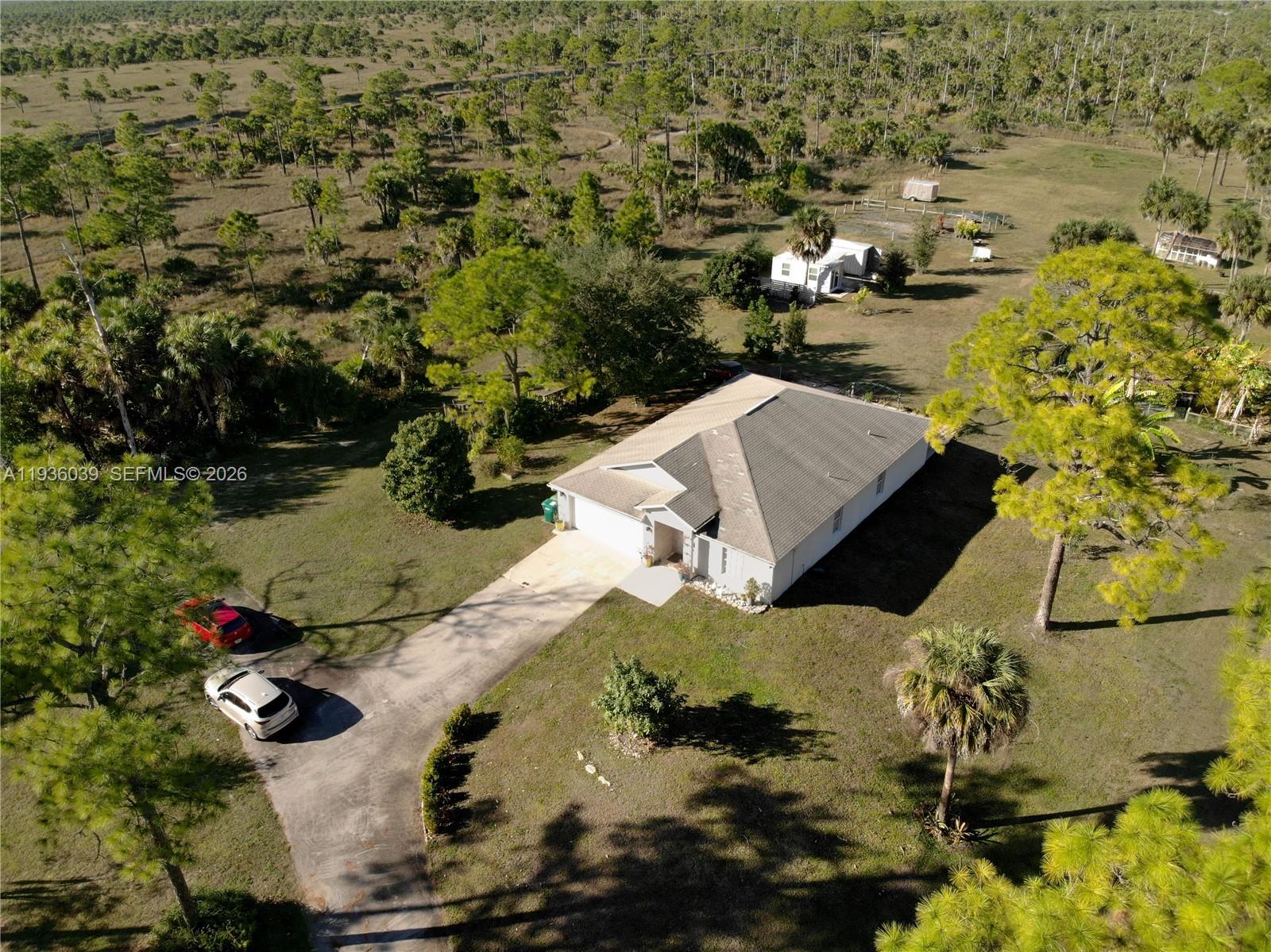 2625 40th Avenue Southeast Naples, FL 34117 - Photo 46 of 81 an aerial view of residential houses with outdoor space