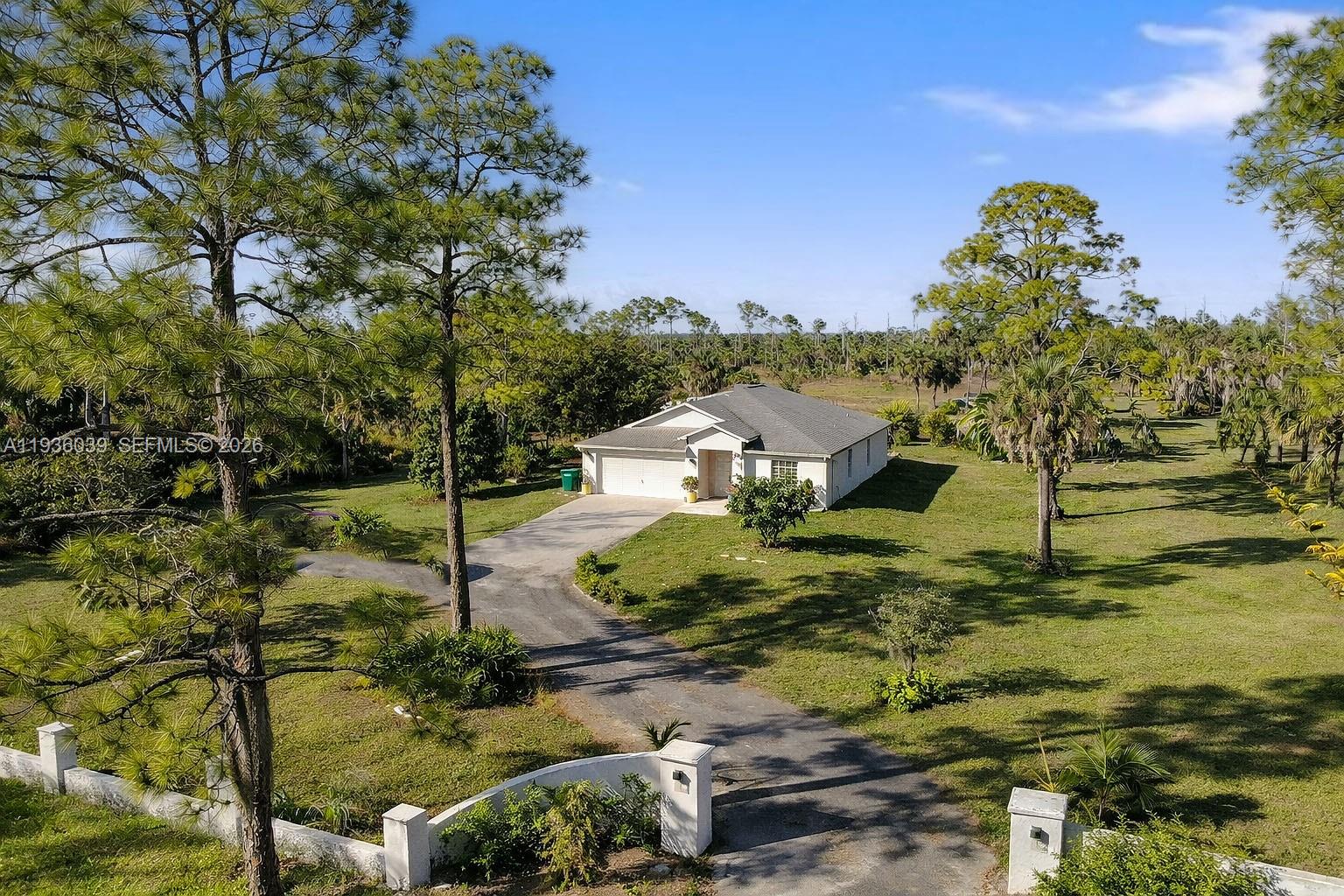 2625 40th Avenue Southeast Naples, FL 34117 - Photo 48 of 81 a aerial view of a house with a yard