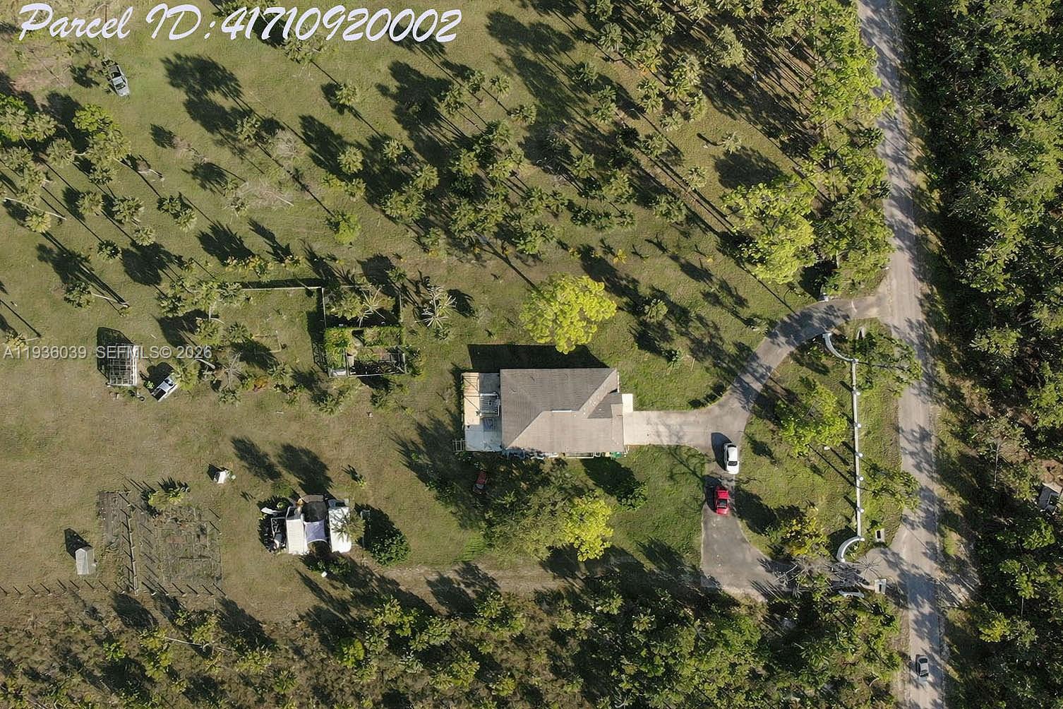 2625 40th Avenue Southeast Naples, FL 34117 - Photo 51 of 81 an aerial view of a house with a yard