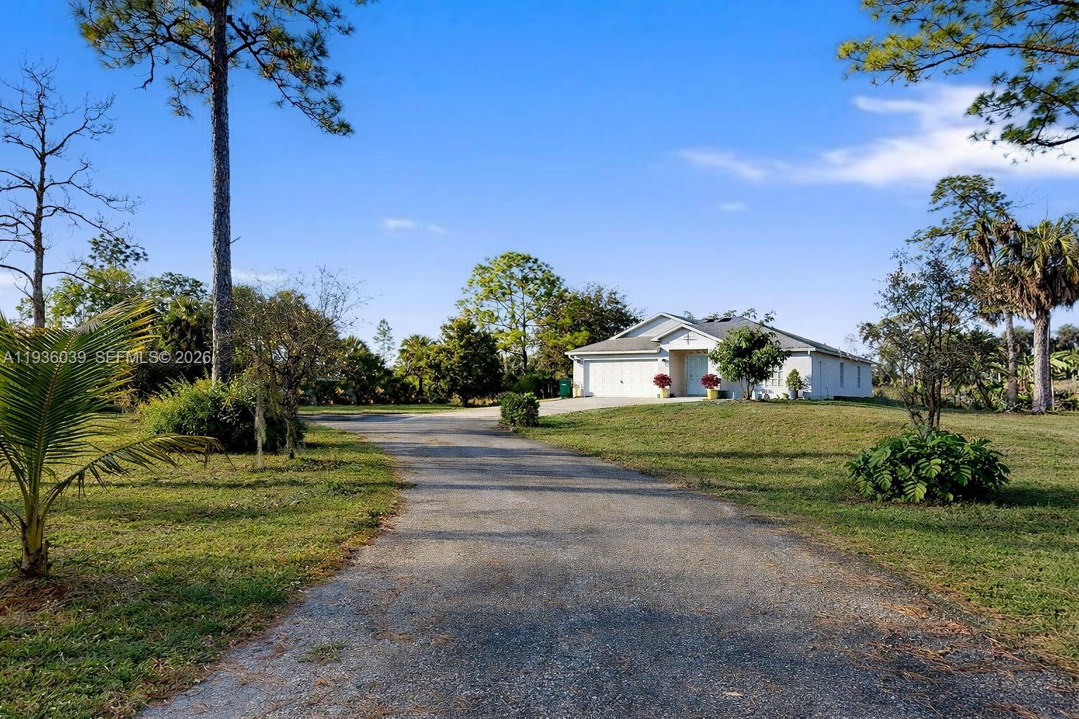 2625 40th Avenue Southeast Naples, FL 34117 - Photo 78 of 81 a view of a house with a big yard