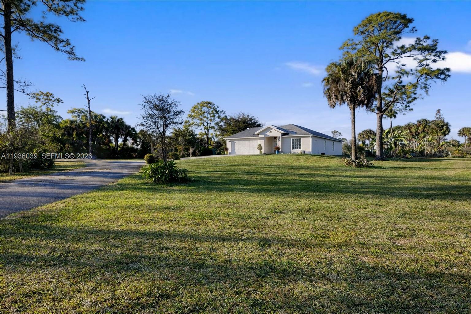 2625 40th Avenue Southeast Naples, FL 34117 - Photo 79 of 81 a view of a house with a big yard