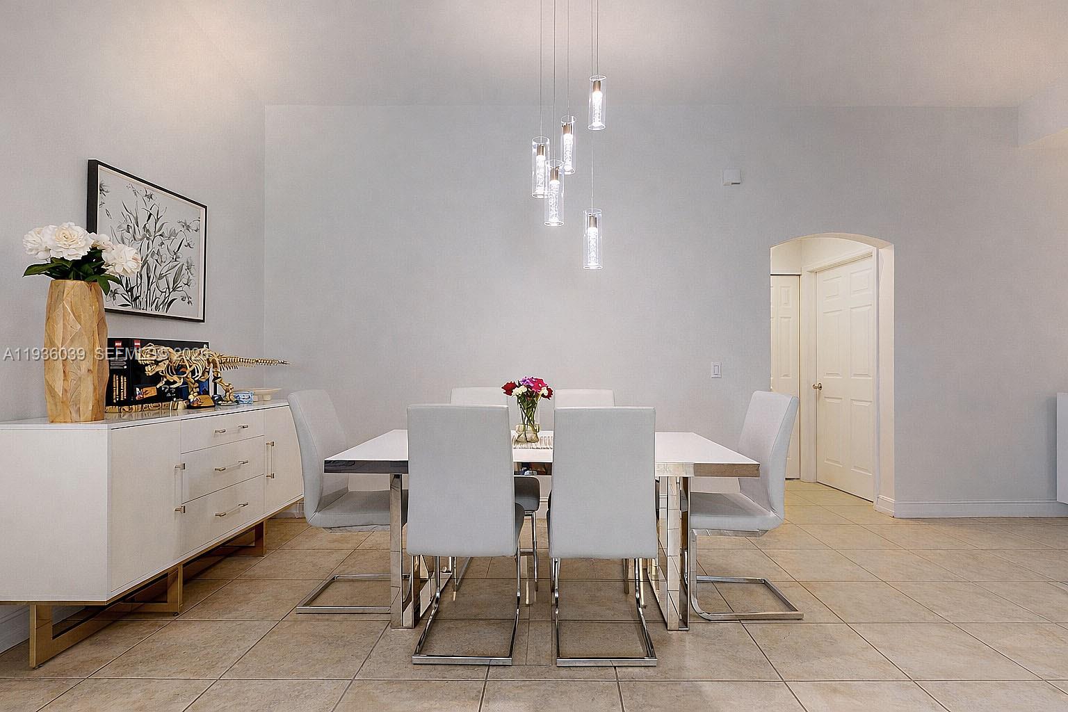 2625 40th Avenue Southeast Naples, FL 34117 - Photo 9 of 81 a view of a dining room with furniture