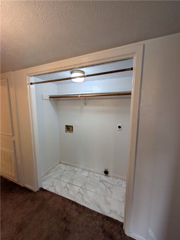 2901 Minnesota Avenue Bryan, TX 77803 - Photo 12 of 16 Washroom with a textured ceiling, light carpet, washer hookup, and electric dryer hookup