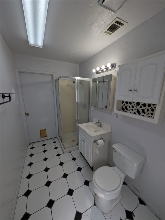 2901 Minnesota Avenue Bryan, TX 77803 - Photo 14 of 16 Bathroom featuring light floors, vanity, and a stall shower