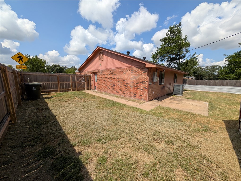 2901 Minnesota Avenue Bryan, TX 77803 - Photo 15 of 16 View of side of home featuring a fenced backyard and a patio area