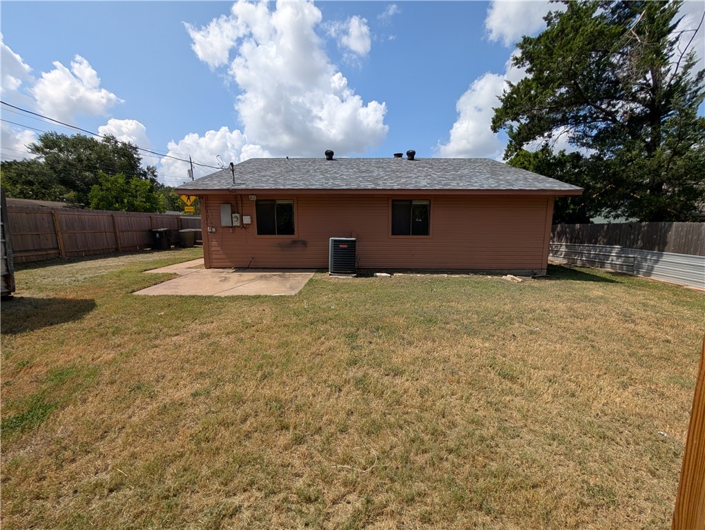 2901 Minnesota Avenue Bryan, TX 77803 - Photo 5 of 16 Rear view of property with a patio and a fenced backyard
