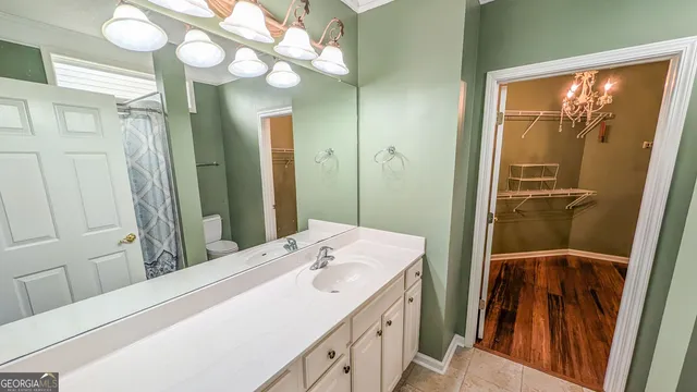 a bathroom with a sink a mirror and a shower
