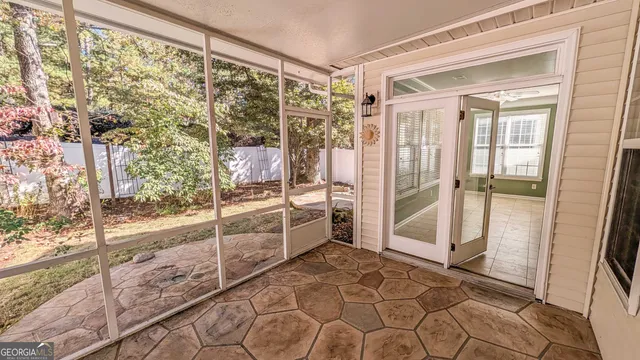 a bathroom with a glass shower door and a bathtub