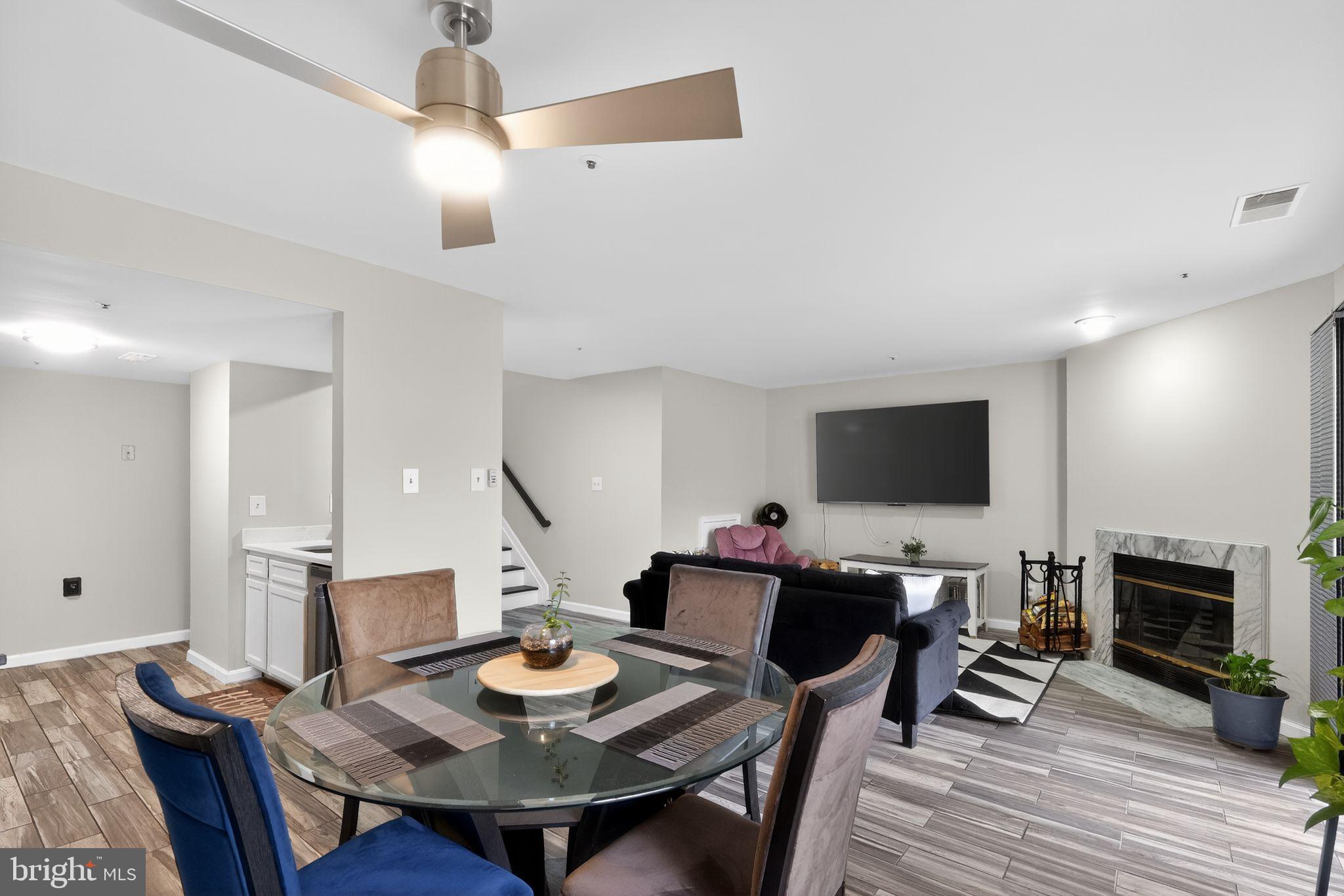 14229 Jib Street, Unit 12 Laurel, MD 20707 - Photo 11 of 17 a view of a dining room with furniture and wooden floor