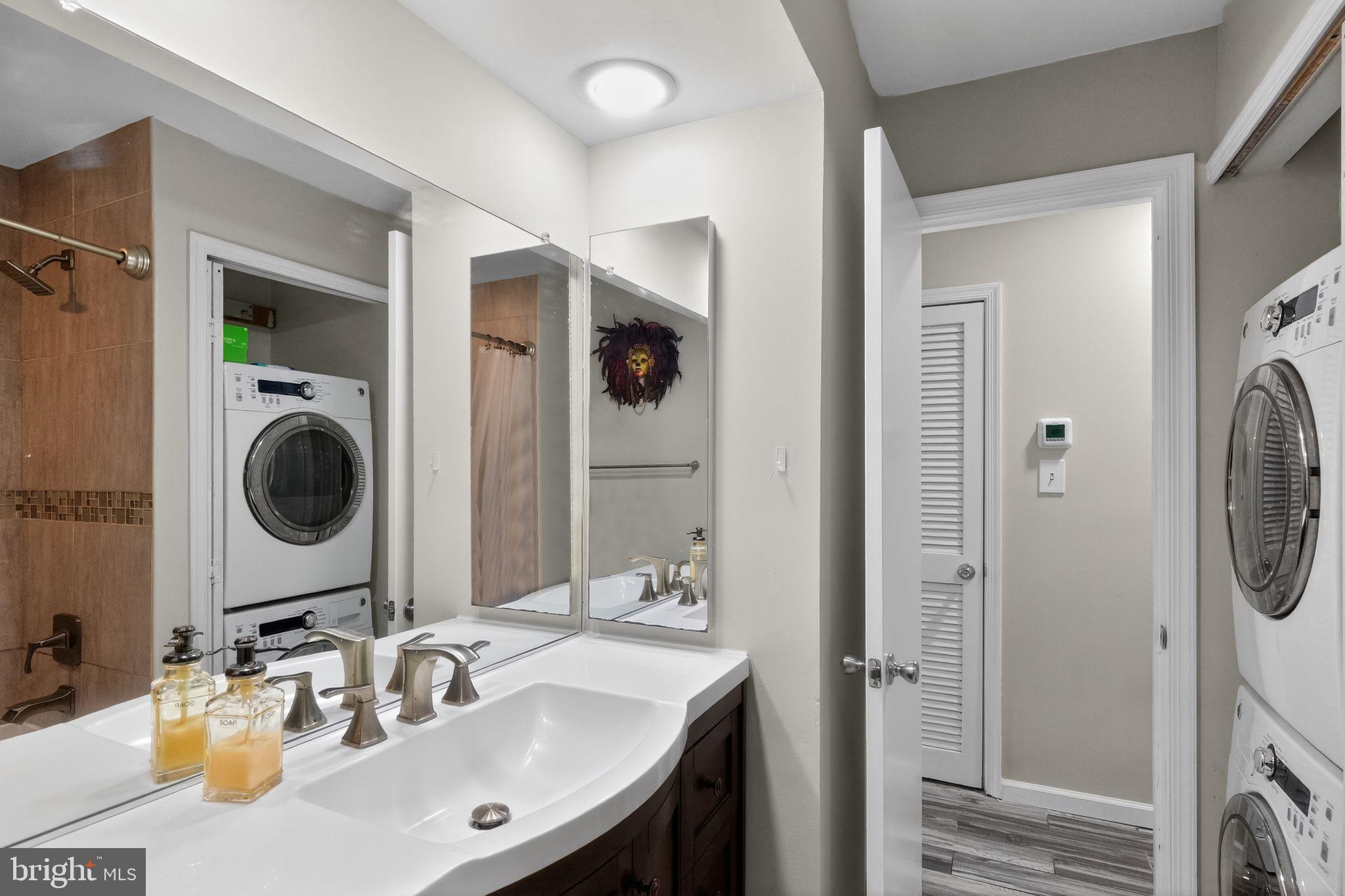 14229 Jib Street, Unit 12 Laurel, MD 20707 - Photo 14 of 17 a bathroom with a sink vanity and a mirror