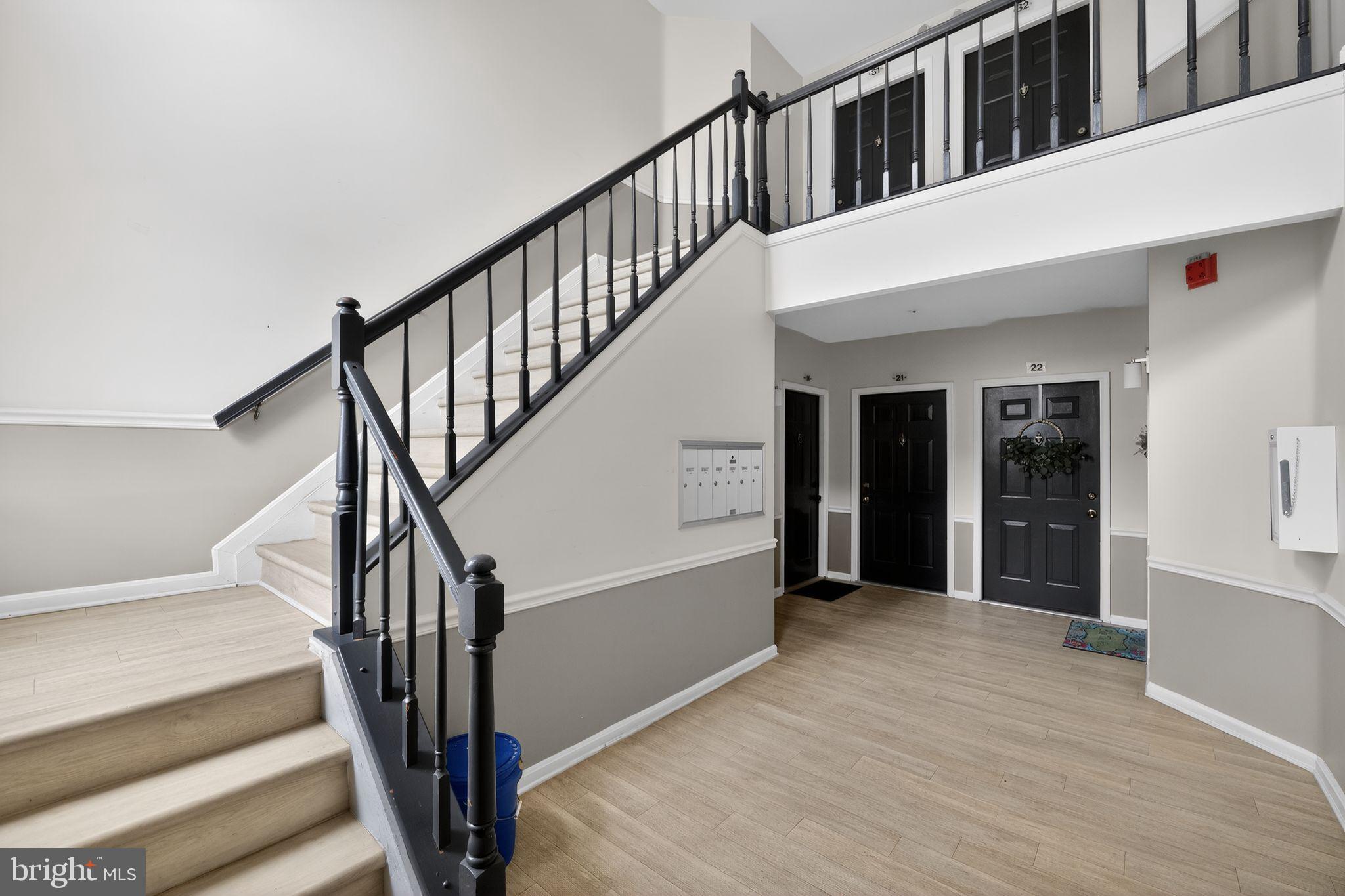 14229 Jib Street, Unit 12 Laurel, MD 20707 - Photo 2 of 17 a view of staircase with white walls and a window