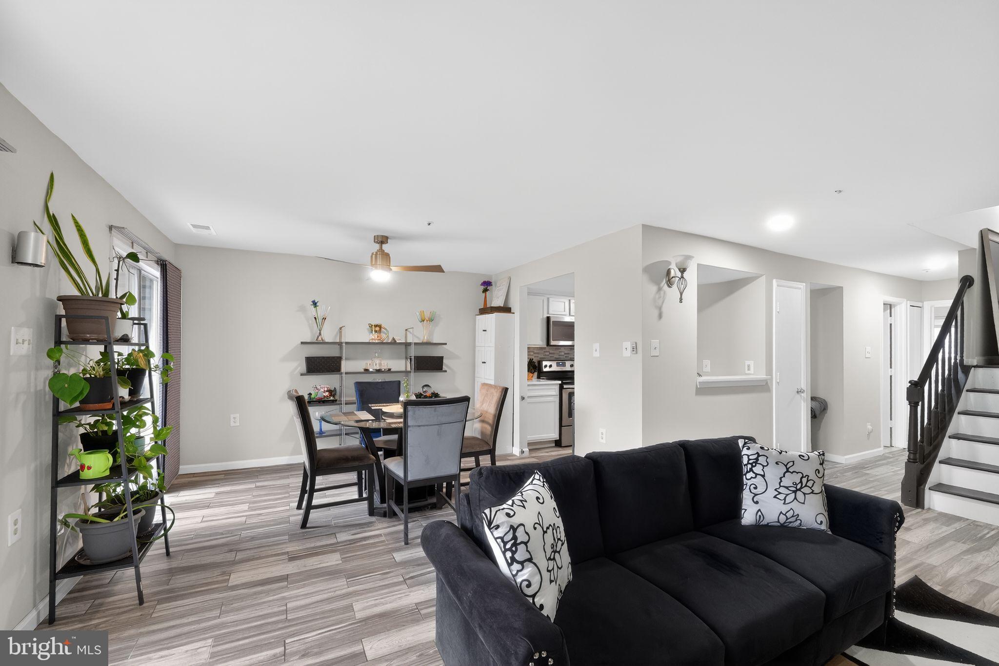 14229 Jib Street, Unit 12 Laurel, MD 20707 - Photo 5 of 17 a living room with furniture and wooden floor