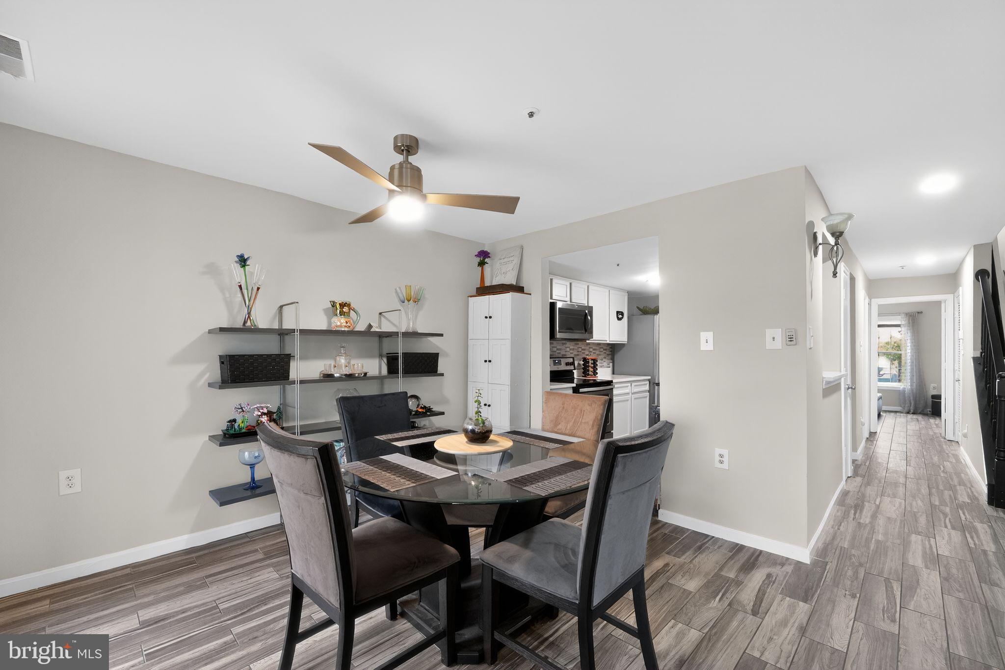 14229 Jib Street, Unit 12 Laurel, MD 20707 - Photo 10 of 17 a view of a dining room with furniture and wooden floor