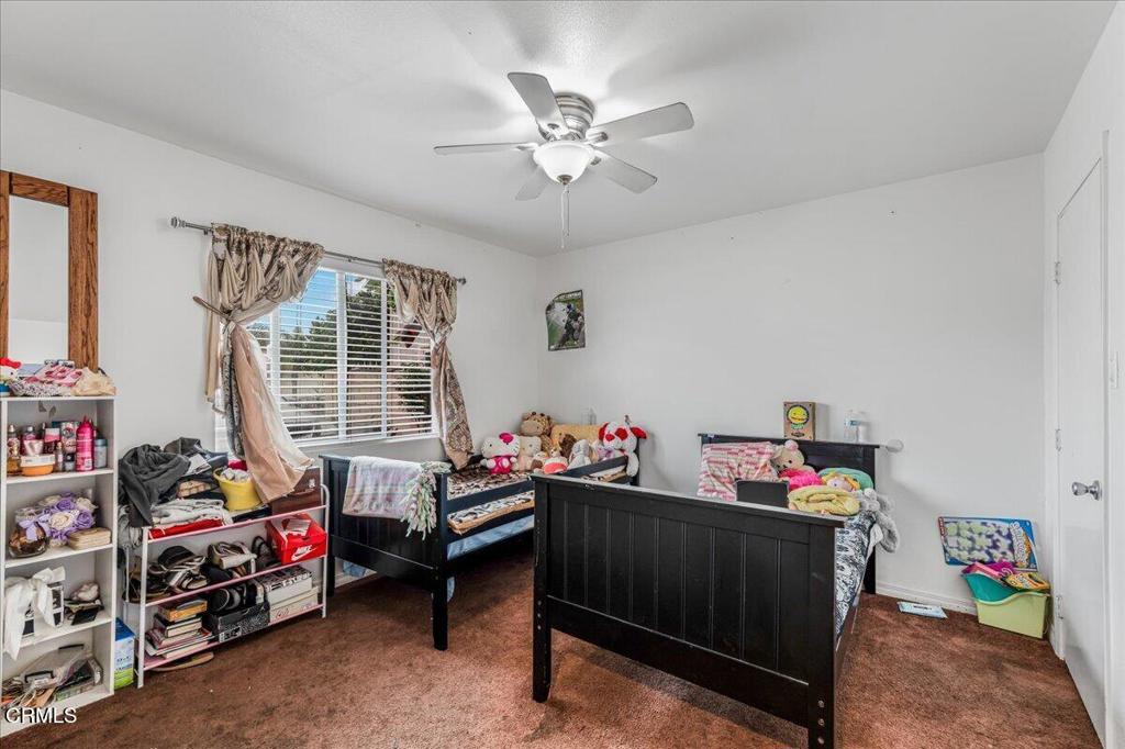 970 Laurel Street West Oxnard, CA 93033 - Photo 15 of 40 a bed room with furniture and a window