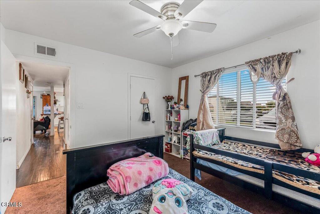 970 Laurel Street West Oxnard, CA 93033 - Photo 17 of 40 a bedroom with furniture and a window