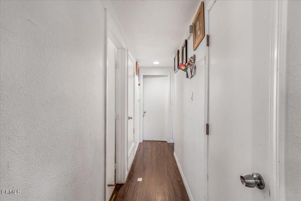 970 Laurel Street West Oxnard, CA 93033 - Photo 21 of 40 a view of a hallway with wooden floor and staircase