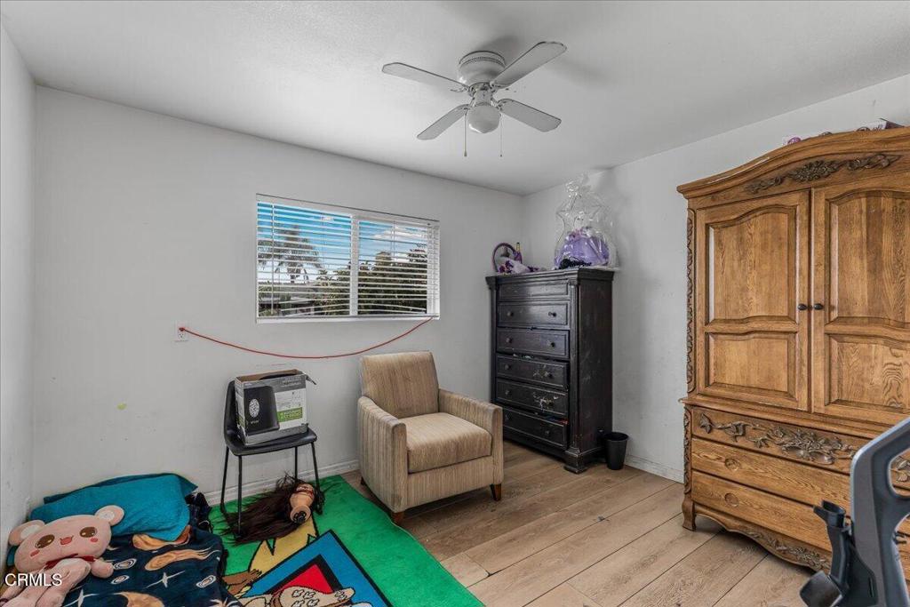 970 Laurel Street West Oxnard, CA 93033 - Photo 22 of 40 a bedroom with furniture and a window