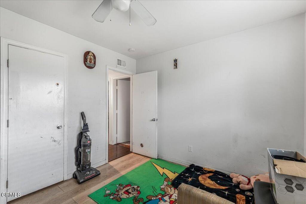 970 Laurel Street West Oxnard, CA 93033 - Photo 23 of 40 a room with toys and a chandelier fan
