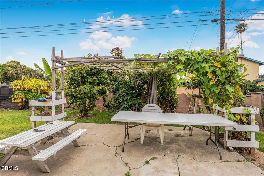 970 Laurel Street West Oxnard, CA 93033 - Photo 36 of 40 a view of a patio with table and chairs and potted plants