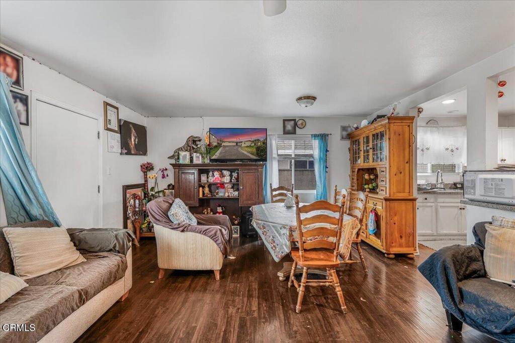 970 Laurel Street West Oxnard, CA 93033 - Photo 8 of 40 a living room with furniture and a wooden floor