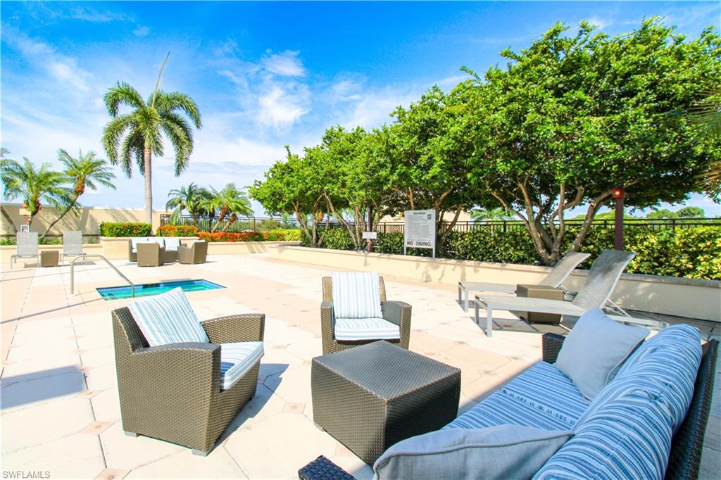 9123 Strada Place, Unit 7410 Naples, FL 34108 - Photo 7 of 50 View of patio featuring outdoor lounge area