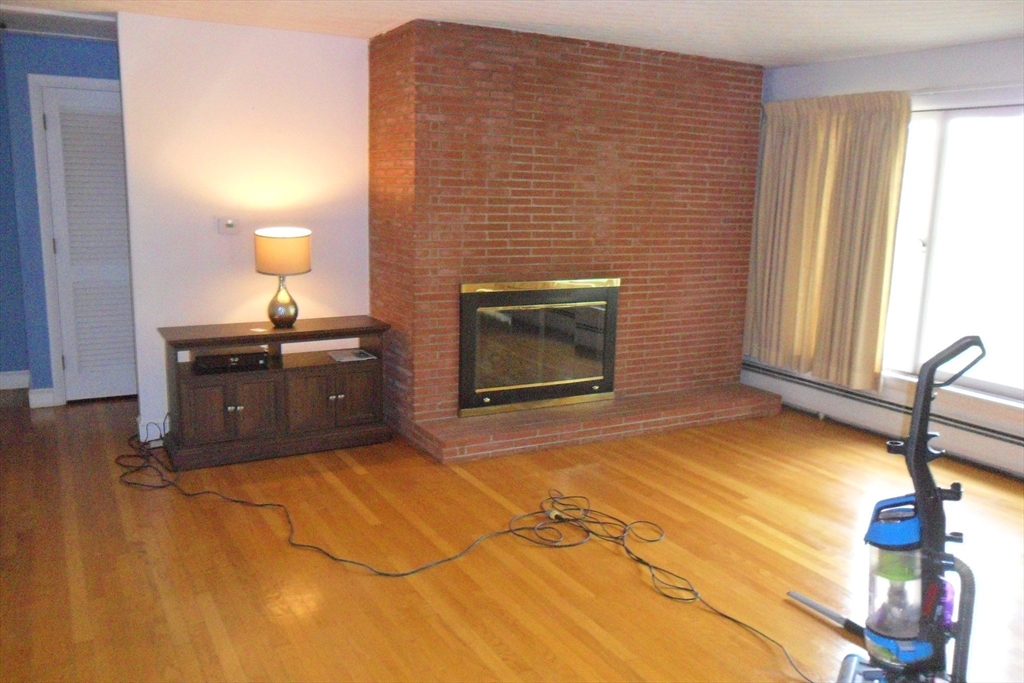 295 A Winter Street Ashland, MA 01721 - Photo 11 of 20 a living room with a fireplace