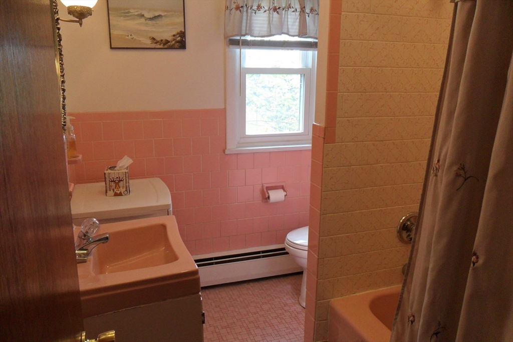295 A Winter Street Ashland, MA 01721 - Photo 14 of 20 a bathroom with a sink a toilet and a mirror
