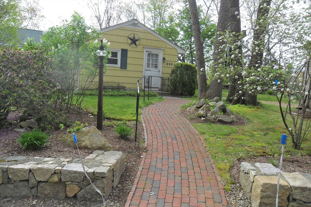 295 A Winter Street Ashland, MA 01721 - Photo 2 of 20 a front view of a house with garden