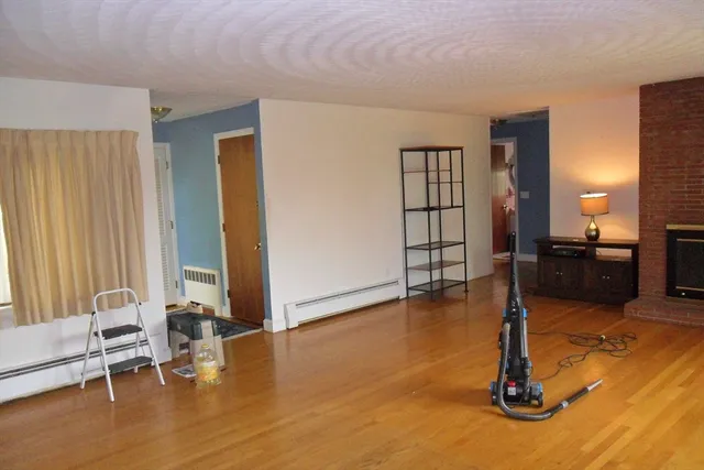 a view of livingroom with furniture and floor to ceiling window
