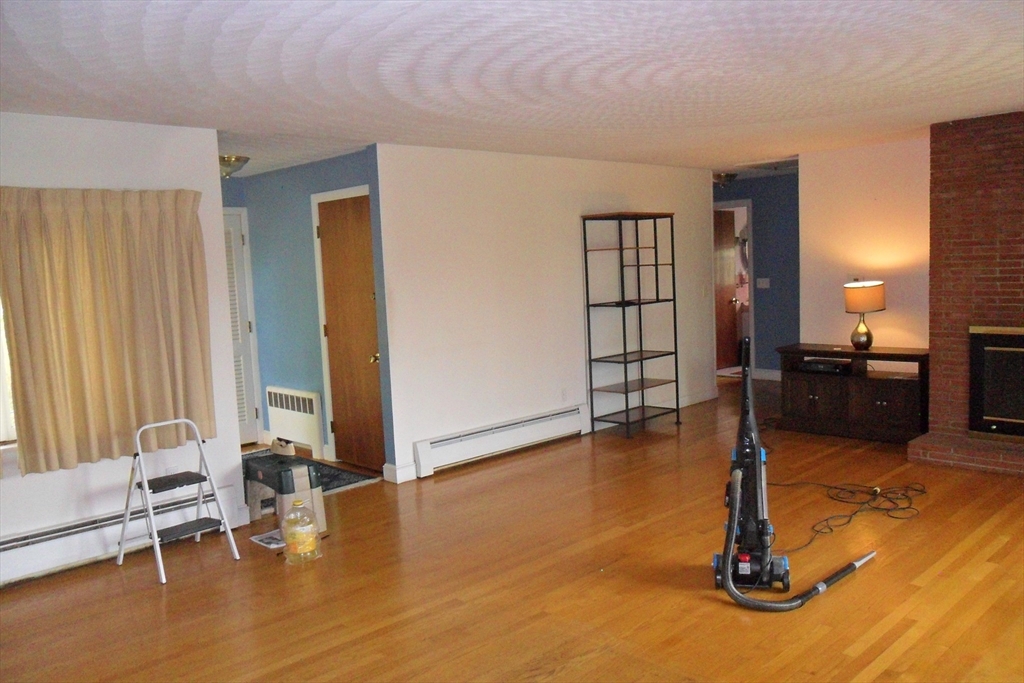 295 A Winter Street Ashland, MA 01721 - Photo 3 of 20 a view of livingroom with furniture and floor to ceiling window
