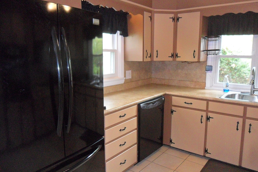 295 A Winter Street Ashland, MA 01721 - Photo 6 of 20 a kitchen with stainless steel appliances a refrigerator and a sink